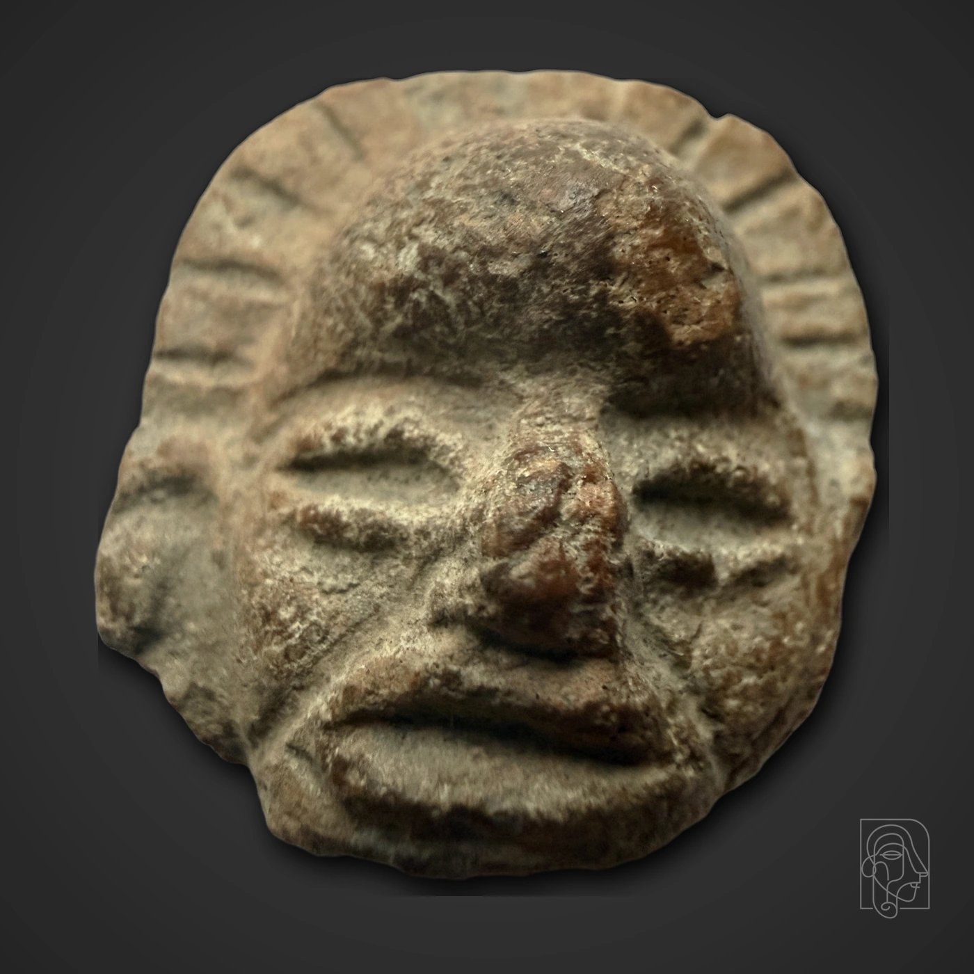Terracotta Head with Radially Incised Flaring Headdress — JCA.2026.025